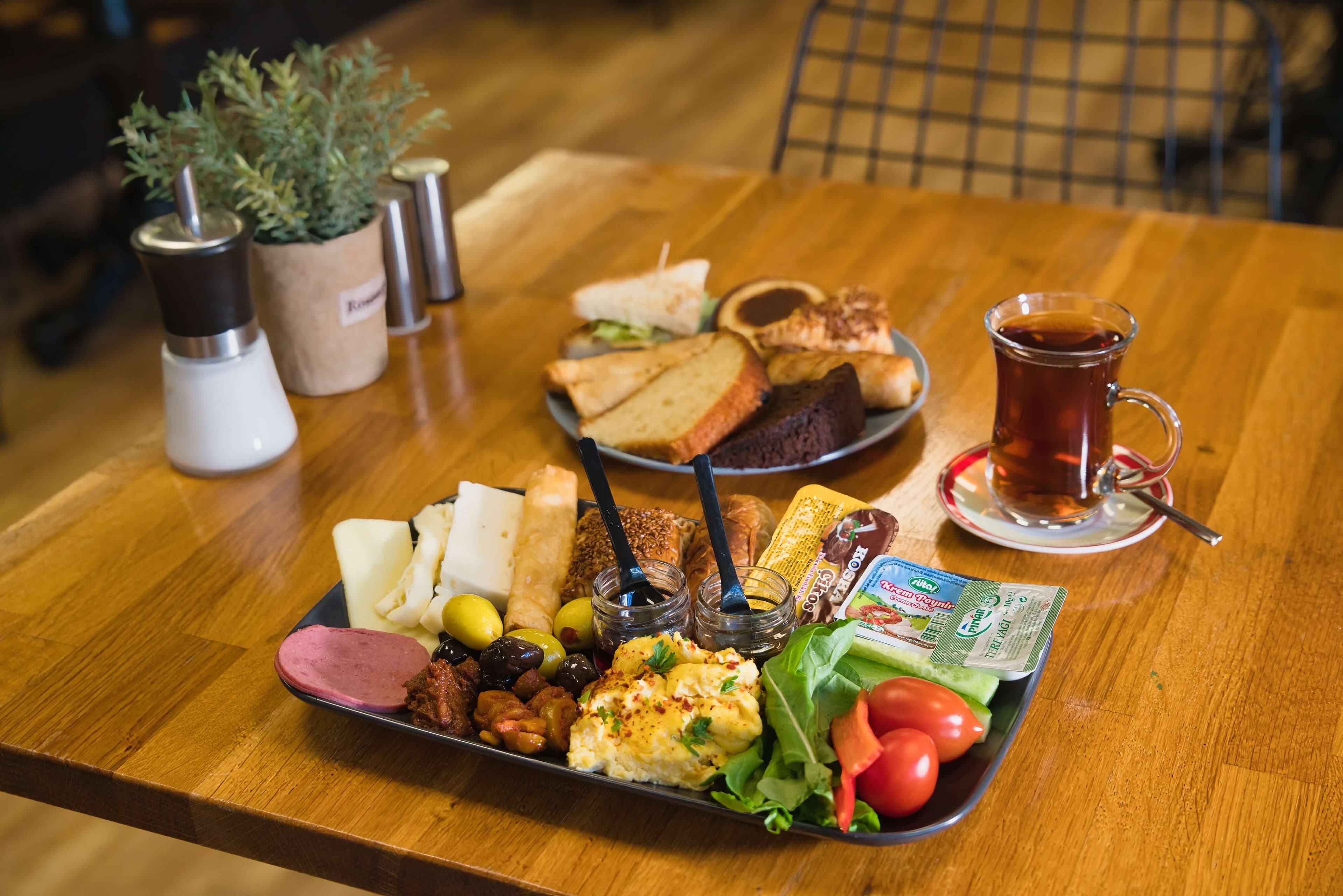 A prepared Turkish breakfast plate served with tea