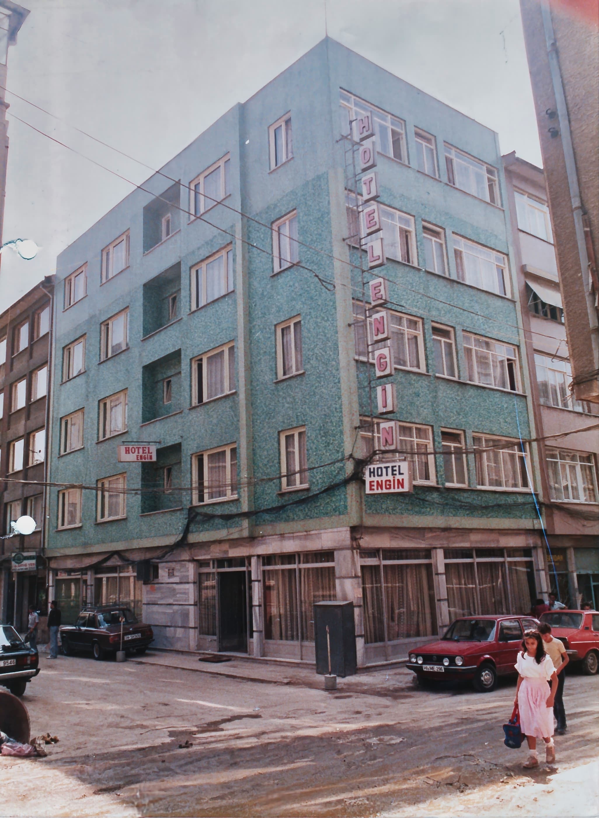 The building as Hotel Engin, the name it opened under in 1972: the corner façade with its vertical neon sign