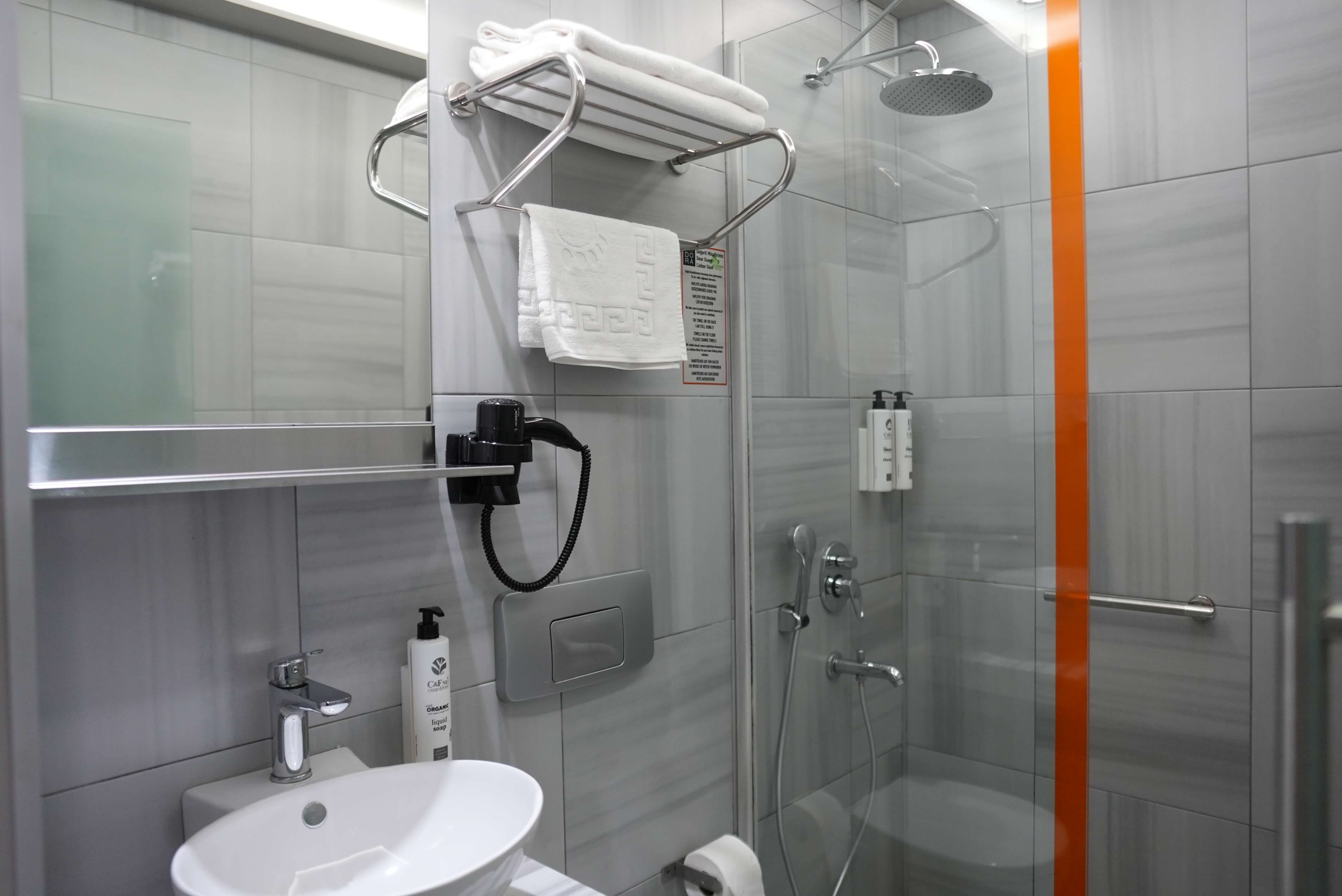 Family room: bathroom with a vessel basin and a glass shower with a rain head
