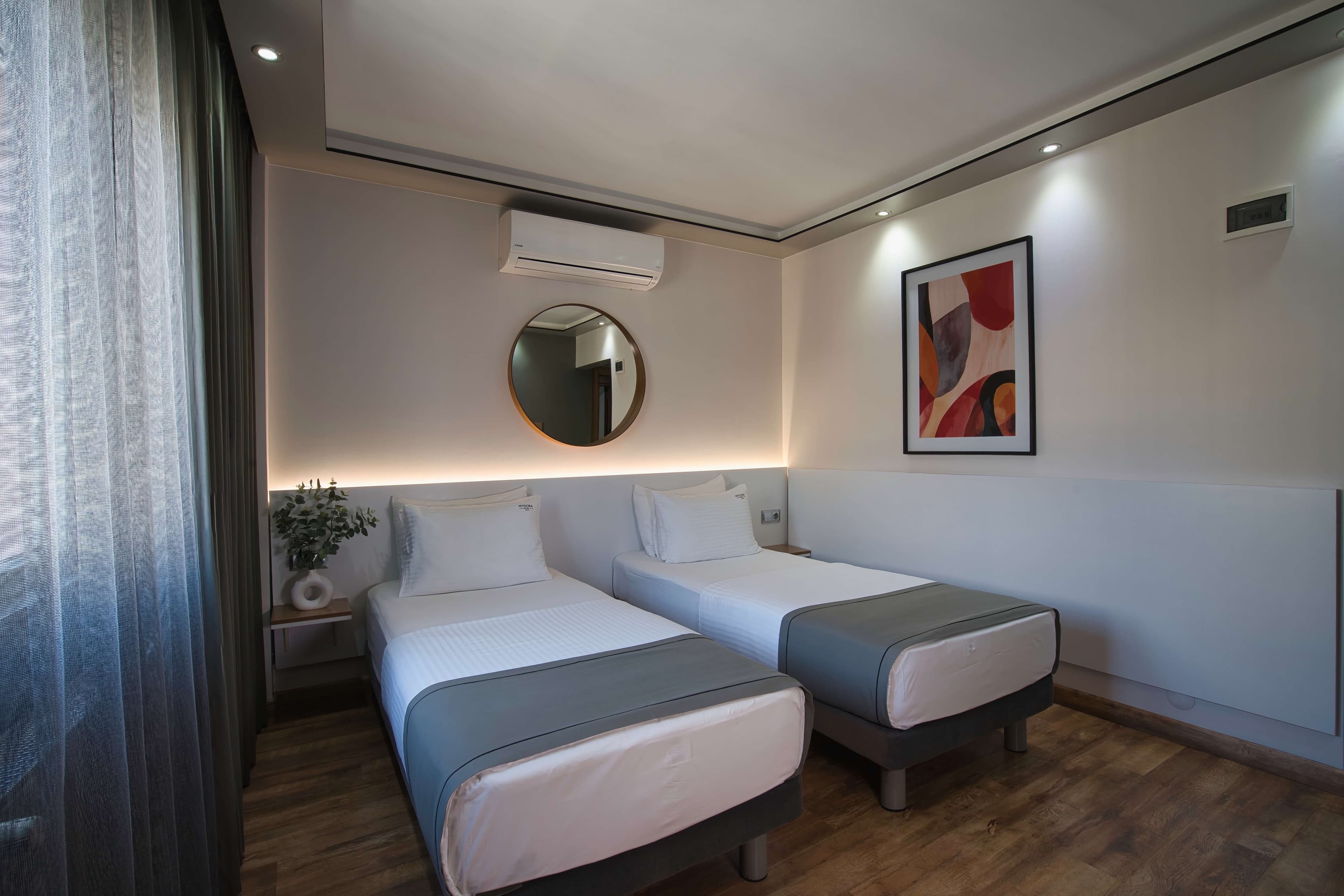 Standard twin: two single beds with backlit headboard